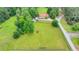 Overhead shot of the home, barn, and sprawling fenced pasture. Plenty of room to roam at 1365 Lower Creighton Rd, Cumming, GA 30028