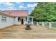 A spacious back deck features white railings, a table, and provides outdoor living space at 1365 Lower Creighton Rd, Cumming, GA 30028