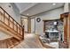 Basement with stone fireplace, hardwood floors, and wood trimmed doorways at 1365 Lower Creighton Rd, Cumming, GA 30028
