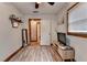 Wood-trimmed bedroom featuring vinyl floors, ceiling fan, and storage at 1365 Lower Creighton Rd, Cumming, GA 30028