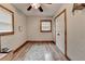 Cozy bedroom with wood-trimmed windows, a ceiling fan, and wood-look flooring at 1365 Lower Creighton Rd, Cumming, GA 30028