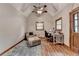 Cozy bedroom features vaulted ceilings, ceiling fan, and chair with ottoman at 1365 Lower Creighton Rd, Cumming, GA 30028