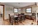 Spacious dining area features hardwood floors, rustic accents, and wooden furniture at 1365 Lower Creighton Rd, Cumming, GA 30028