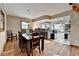 Open dining area with view of kitchen and hardwood floors at 1365 Lower Creighton Rd, Cumming, GA 30028