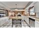 Bright kitchen featuring butcher block countertops, white cabinetry, stainless appliances, and tile floors at 1365 Lower Creighton Rd, Cumming, GA 30028