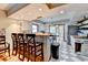 Bright kitchen with stainless steel appliances, tile flooring, butcher block countertops, island, and barstool seating at 1365 Lower Creighton Rd, Cumming, GA 30028
