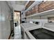 Convenient laundry room equipped with modern washer and dryer units at 1365 Lower Creighton Rd, Cumming, GA 30028