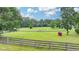 Fenced in pastures make this property ideal for horses at 1365 Lower Creighton Rd, Cumming, GA 30028
