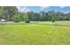 The large lot is fenced in, making it ideal for horses at 1365 Lower Creighton Rd, Cumming, GA 30028