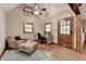 Cozy office space with hardwood floors, comfortable seating and natural light at 1365 Lower Creighton Rd, Cumming, GA 30028