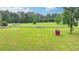 A lush fenced pasture is ideal for livestock or enjoying open space at 1365 Lower Creighton Rd, Cumming, GA 30028
