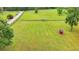 A beautiful pasture, fully fenced, provides ample space for livestock or recreation at 1365 Lower Creighton Rd, Cumming, GA 30028