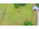 A top-down shot shows a vast green pasture with a storage shed and a secure fence at 1365 Lower Creighton Rd, Cumming, GA 30028