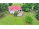 Back exterior shot showing a large deck and a red roof; perfect for outdoor living at 1365 Lower Creighton Rd, Cumming, GA 30028