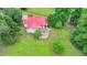 Aerial view of the home's back exterior showing a large wooden deck, great for entertaining or relaxing at 1365 Lower Creighton Rd, Cumming, GA 30028