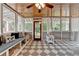 Cozy sunroom features wood ceilings, lots of windows and a built-in bench at 1365 Lower Creighton Rd, Cumming, GA 30028