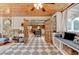 Bright sunroom boasting wood ceilings, stone details and access to the kitchen at 1365 Lower Creighton Rd, Cumming, GA 30028