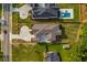 Aerial view of a property showing the layout of the house, backyard, pool, and surrounding neighborhood at 157 Shadburn Ferry Rd, Buford, GA 30518