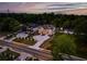 Aerial view of tree-lined luxury homes in a neighborhood at 157 Shadburn Ferry Rd, Buford, GA 30518