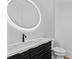 Modern bathroom vanity with a striking round mirror and sleek fixtures at 157 Shadburn Ferry Rd, Buford, GA 30518