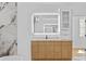 Bright bathroom boasts a long wood vanity with storage, and a modern illuminated mirror above it at 157 Shadburn Ferry Rd, Buford, GA 30518