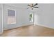 Bright bedroom features beautiful hardwood floors, large windows, and ample natural light, offering a serene space at 157 Shadburn Ferry Rd, Buford, GA 30518