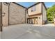 Exterior shot showcasing the spacious driveway and two-car garage of the home at 157 Shadburn Ferry Rd, Buford, GA 30518