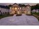 Striking brick exterior with grand entrance, circular driveway, and attached two-car garage at 157 Shadburn Ferry Rd, Buford, GA 30518