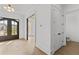 Open foyer featuring wood floors, large entry doors and closet space at 157 Shadburn Ferry Rd, Buford, GA 30518