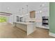 Modern kitchen with stainless appliances, large island, and sleek design at 157 Shadburn Ferry Rd, Buford, GA 30518