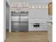 Gourmet kitchen featuring stainless steel fridge and custom cabinets at 157 Shadburn Ferry Rd, Buford, GA 30518