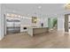 Spacious kitchen features stainless appliances, large island, and open floor plan at 157 Shadburn Ferry Rd, Buford, GA 30518
