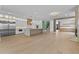 Open floor plan living room and kitchen with expansive wood floors and modern design at 157 Shadburn Ferry Rd, Buford, GA 30518
