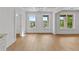 Spacious living room with natural light and windows offering outdoor views at 157 Shadburn Ferry Rd, Buford, GA 30518