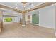 Spacious living room with view of the kitchen, beams, and bright white walls at 157 Shadburn Ferry Rd, Buford, GA 30518