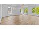 Spacious living room with wainscoting, recessed lighting, and lots of bright, natural light at 157 Shadburn Ferry Rd, Buford, GA 30518