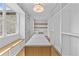 Large walk-in closet features custom shelving and a center island, offering ample storage and organization at 157 Shadburn Ferry Rd, Buford, GA 30518