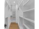 Spacious walk-in closet features custom shelving and ample storage, perfect for organization at 157 Shadburn Ferry Rd, Buford, GA 30518