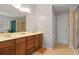 Bathroom featuring a double sink vanity, tiled floors, and a separate shower enclosure at 3224 Wolf Club Sw Ln, Atlanta, GA 30349