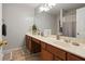 Bright bathroom featuring a large vanity, and neutral tile, offering a clean and functional space at 3224 Wolf Club Sw Ln, Atlanta, GA 30349