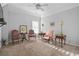 Cozy bedroom featuring neutral carpet, natural light, and traditional furniture at 3224 Wolf Club Sw Ln, Atlanta, GA 30349