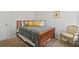 Cozy bedroom featuring carpet and natural light, with a vintage styled chair at 3224 Wolf Club Sw Ln, Atlanta, GA 30349