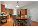 Charming kitchen boasts wooden cabinets, stainless steel appliances, and a cozy dining area at 3224 Wolf Club Sw Ln, Atlanta, GA 30349