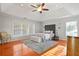 Bright main bedroom featuring hardwood floors, sitting area and decorative ceiling at 3224 Wolf Club Sw Ln, Atlanta, GA 30349