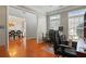 Bright office with hardwood floors and multiple windows, perfect for a productive workspace with natural light at 3224 Wolf Club Sw Ln, Atlanta, GA 30349