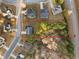 Aerial view of a large property with mature trees, a home, and bordered in red at 3224 Wolf Club Sw Ln, Atlanta, GA 30349