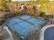 Aerial view of tennis courts in a well-maintained community with benches and walkways at 3224 Wolf Club Sw Ln, Atlanta, GA 30349