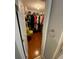 Walk-in closet with custom shelving, hanging racks, and storage space at 3224 Wolf Club Sw Ln, Atlanta, GA 30349