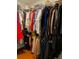 Walk-in closet with custom shelving, hanging racks, and storage space at 3224 Wolf Club Sw Ln, Atlanta, GA 30349