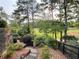 Enjoy the steps down to the backyard with a view of green scenery and trees at 8710 Mount Rushmore Dr, Johns Creek, GA 30022